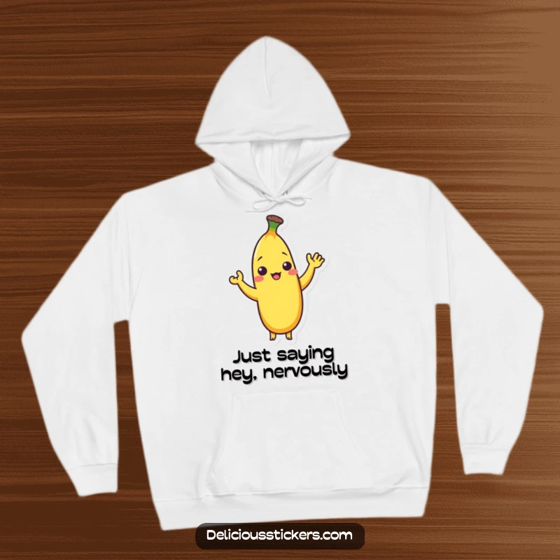 Funny hoodie with a shy banana character giving a small, friendly wave, perfect for cozy wear.