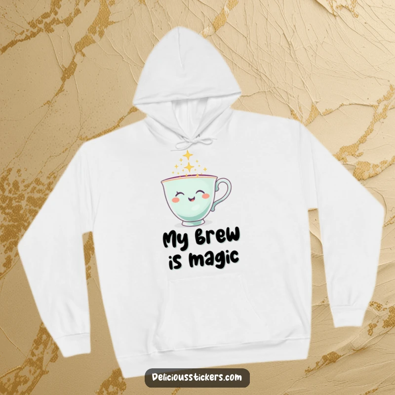 Funny Teacup Hoodie with a winking teacup character pouring sparkles, soft and enchanting apparel.